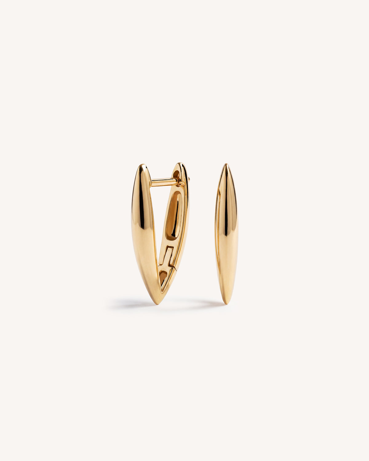 A pair of gold-toned geometric "V" shaped huggie hoop earrings with a polished finish, displayed on a clean off-white background.