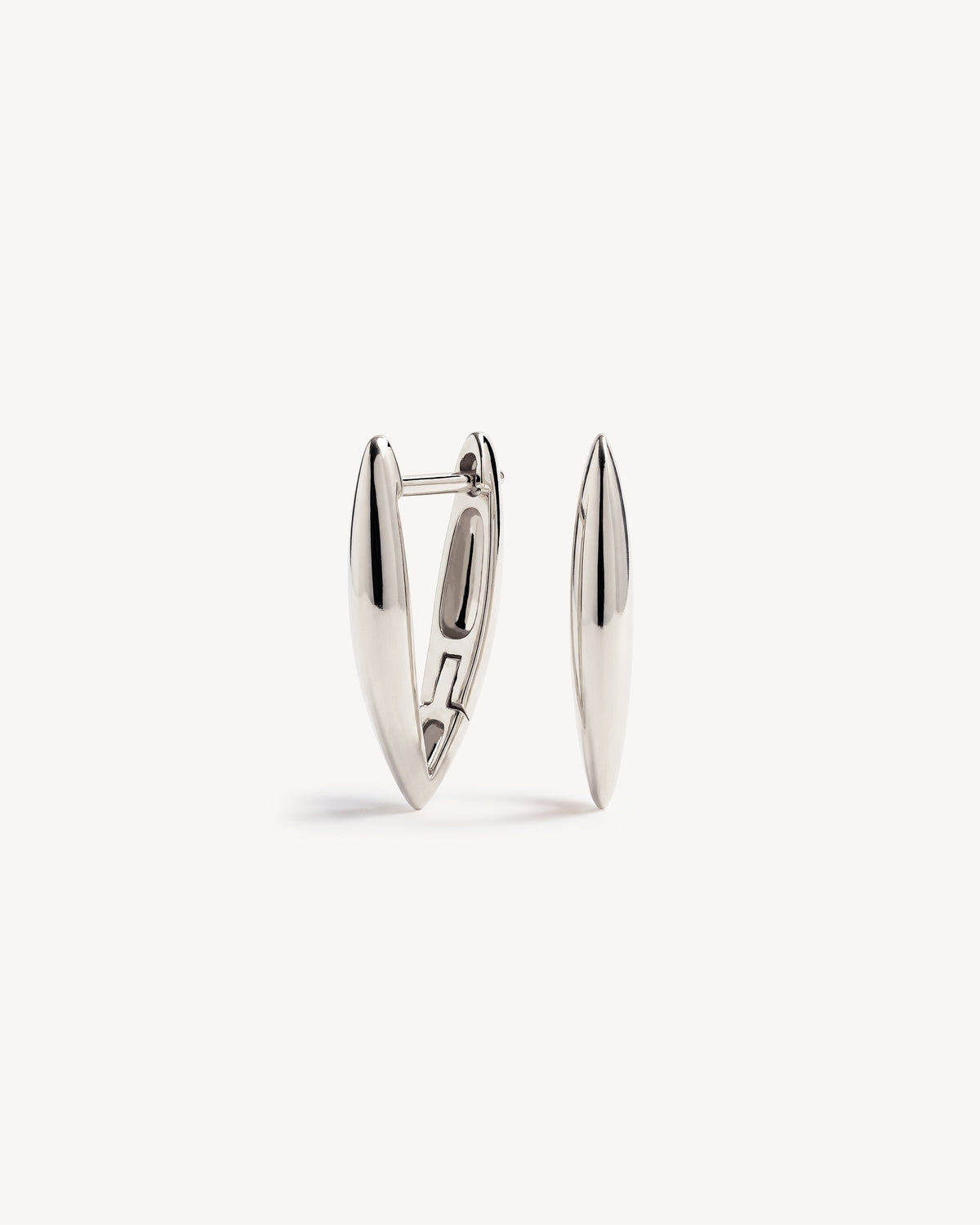 A pair of polished 925 silver geometric 'V' shaped huggie hoop earrings with a pointed, elongated triangular design, displayed on a clean off-white background.