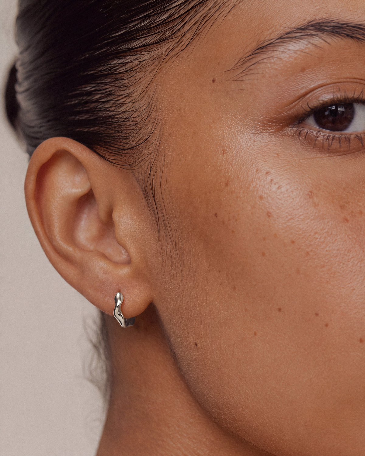 Wavy Hoops in Sterling Silver on Model