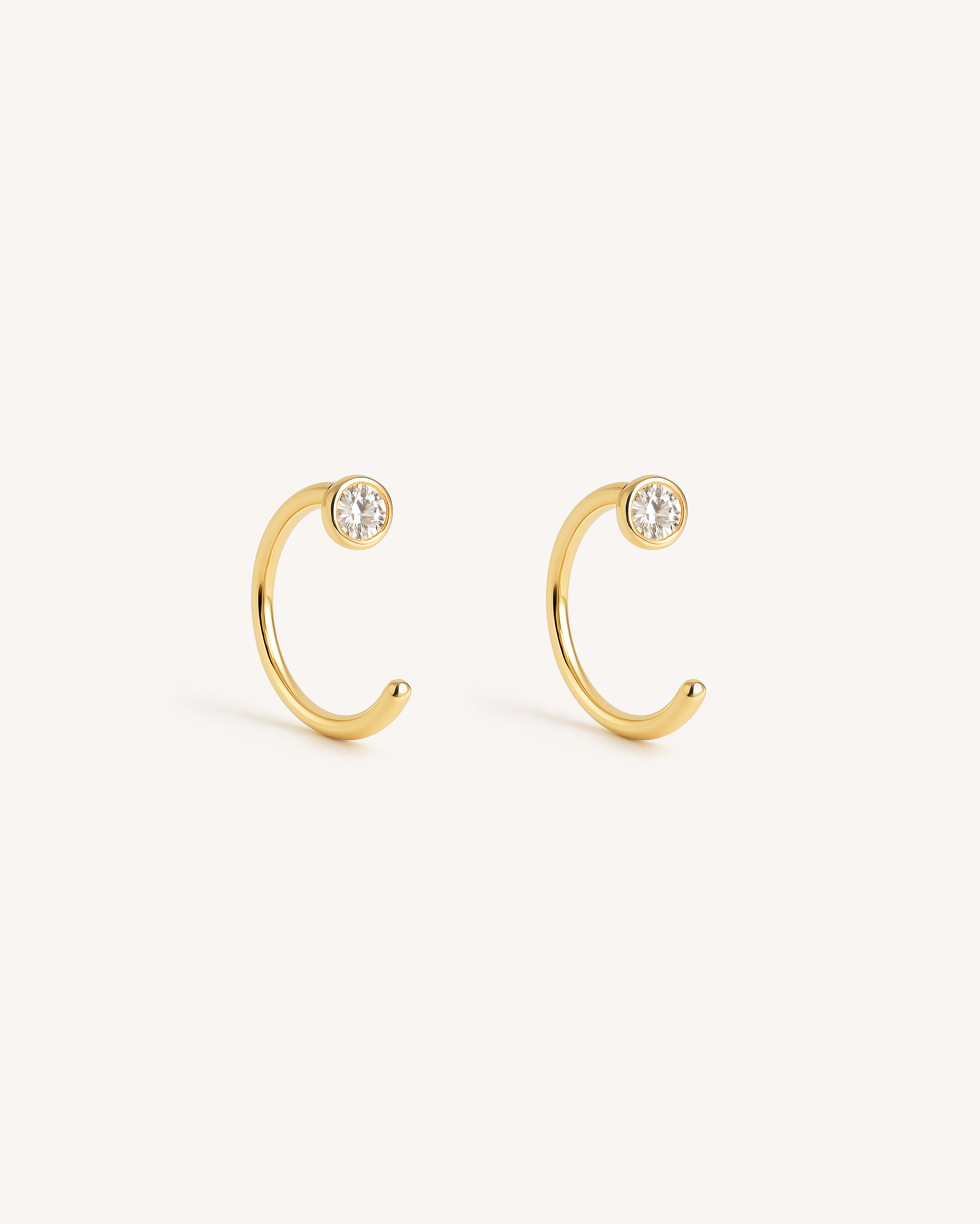 Open Solitaire Huggie Earrings in Gold