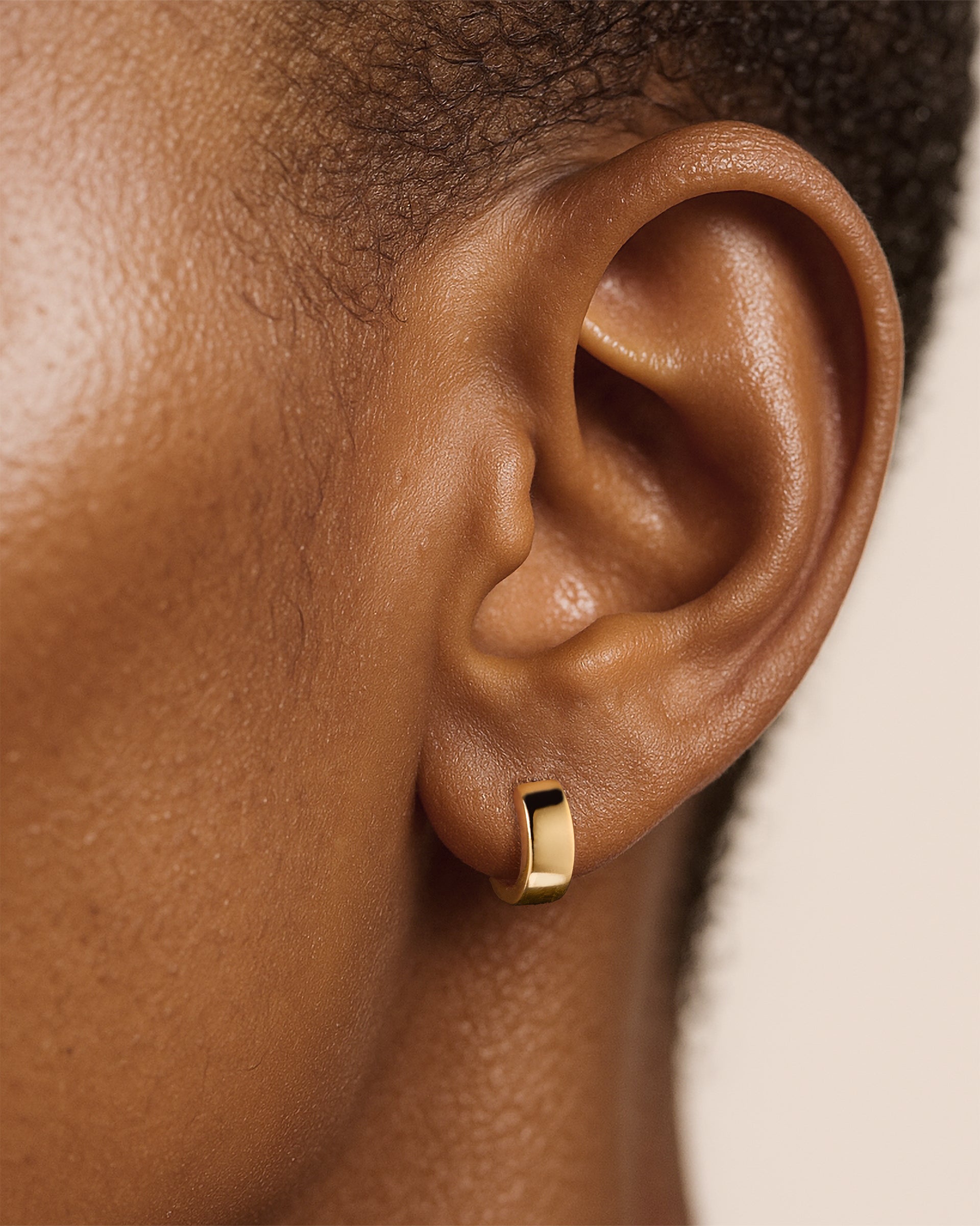 Mini Chunky Huggie Hoops in Gold — alternate view