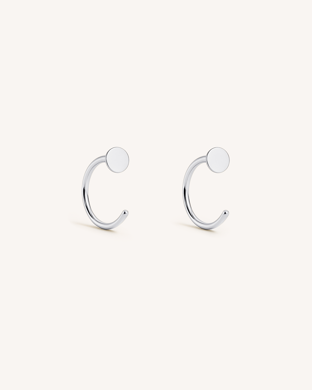 Open Disc Huggie Earrings in Silver
