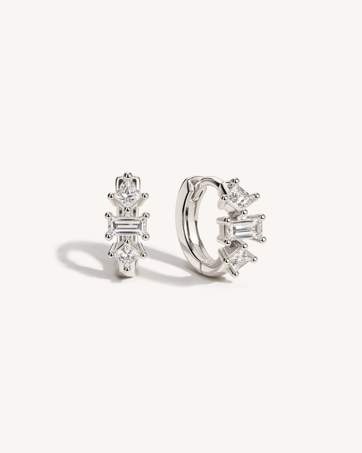 Baguette Trinity Huggie Hoops in 925 Sterling Silver, front and side view, baguette and princess-cut crystal huggie hoop earrings