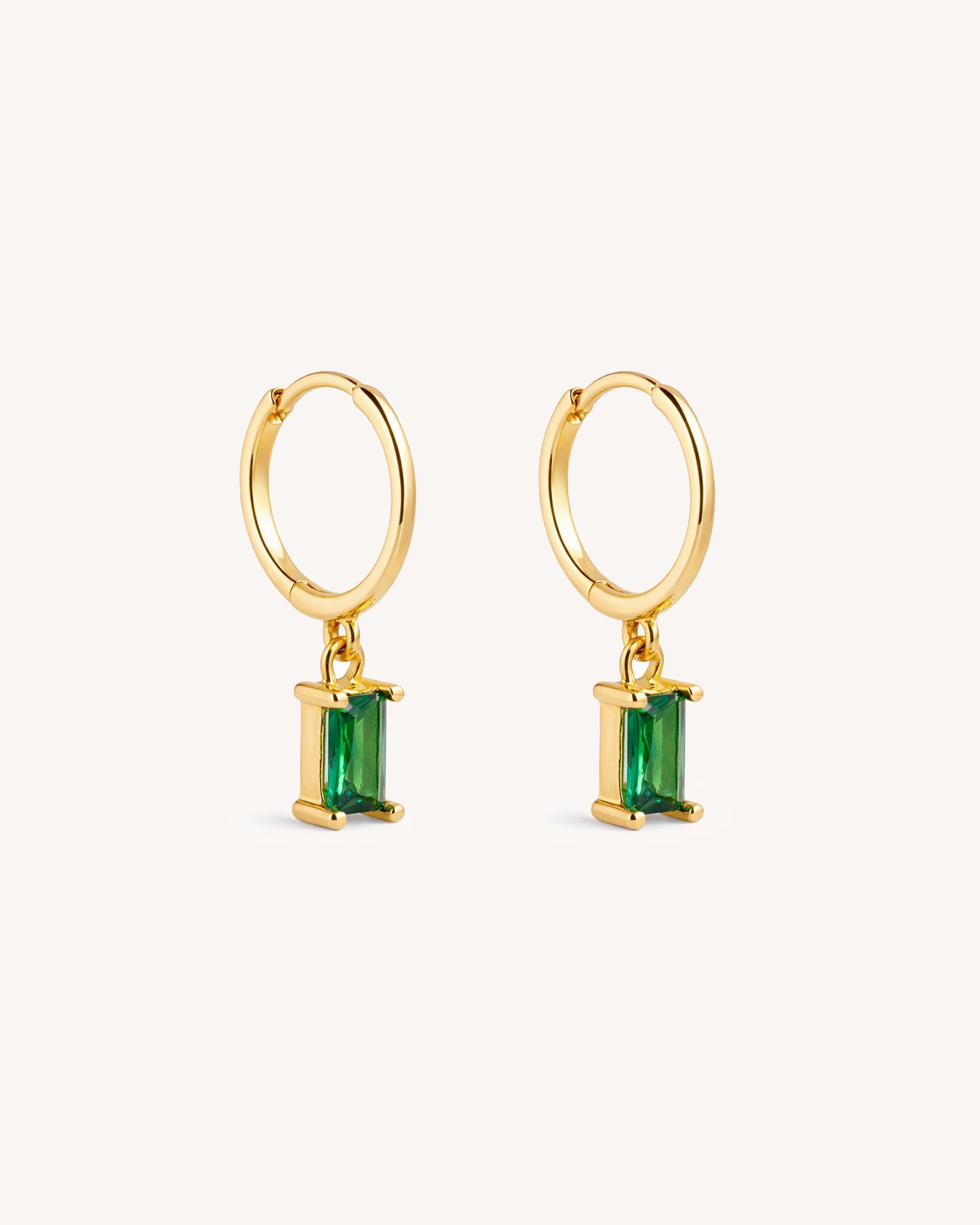 Dangle Baguette Huggie Hoops in Gold — Emerald