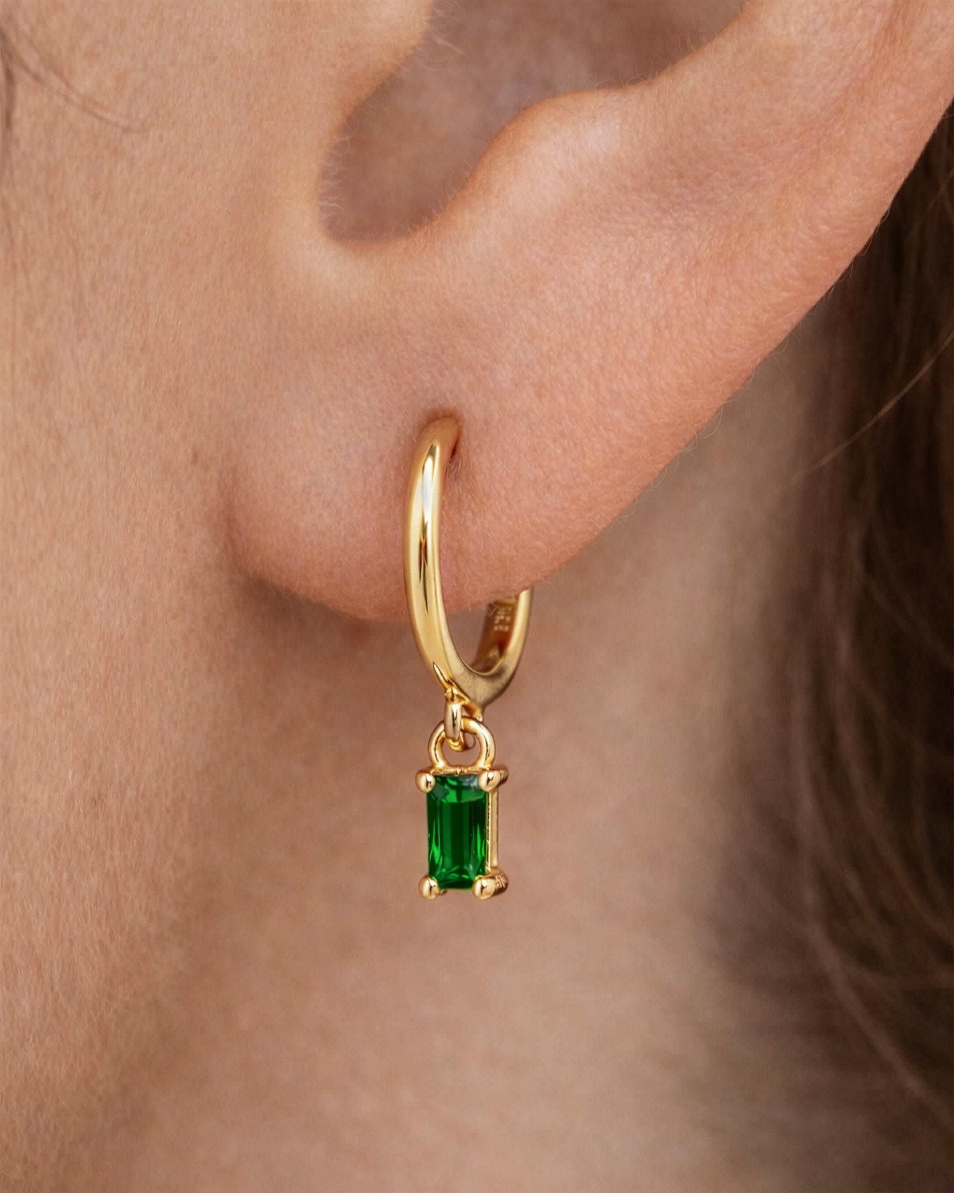 Dangle Baguette Huggie Hoops in Gold — Emerald — alternate view