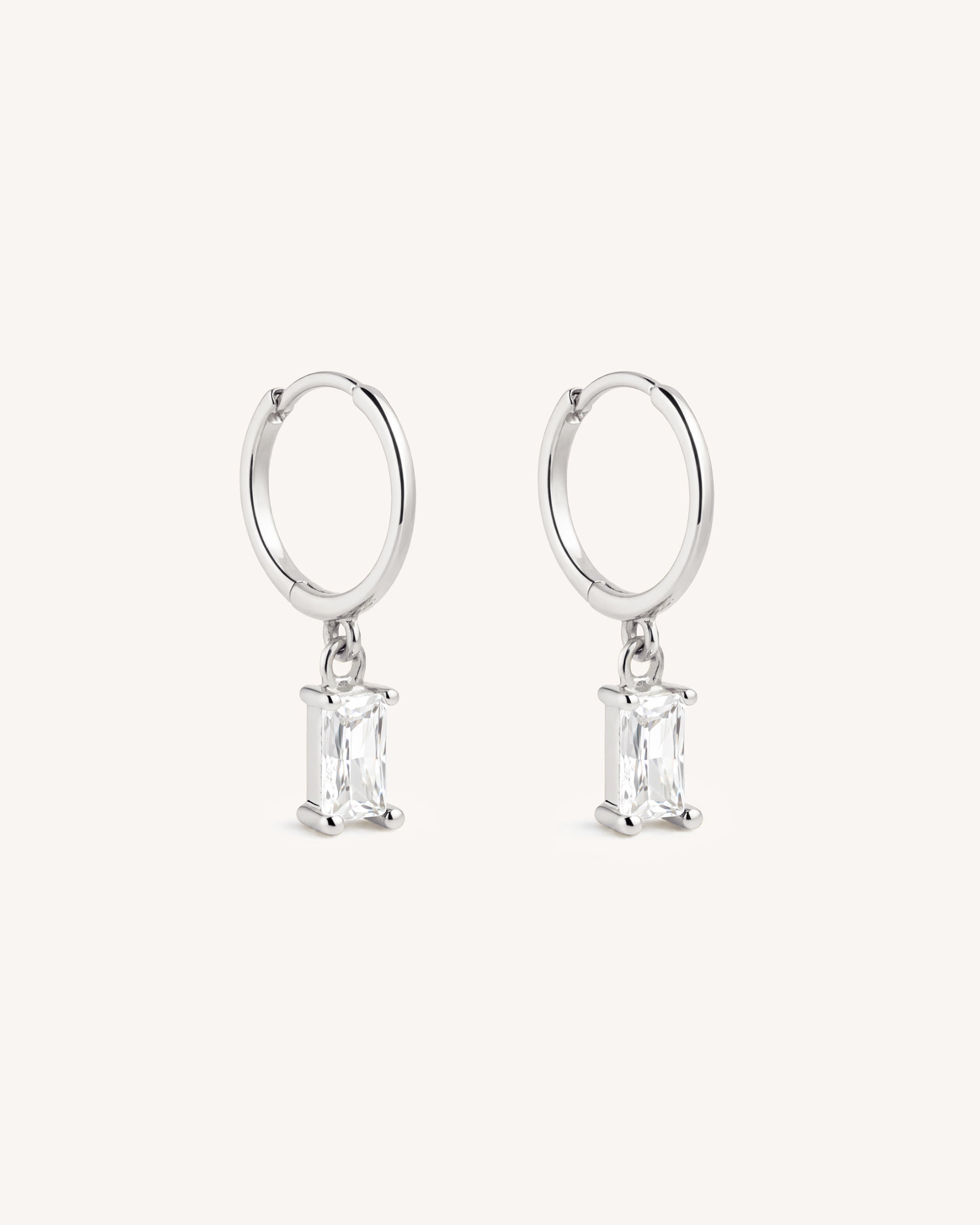 Dangle Baguette Huggie Hoops in Silver — Crystal