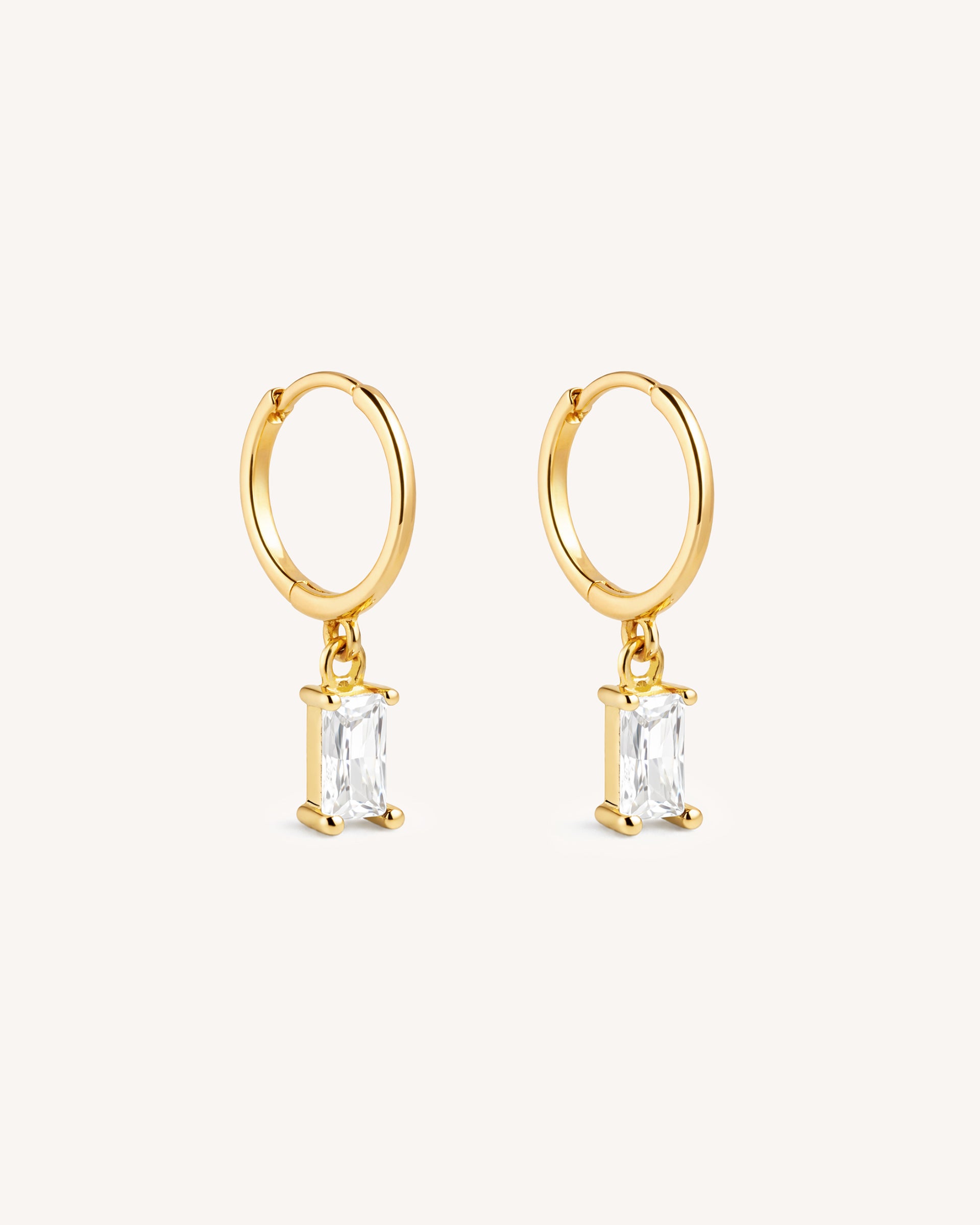 Dangle Baguette Huggie Hoops in Gold — Crystal