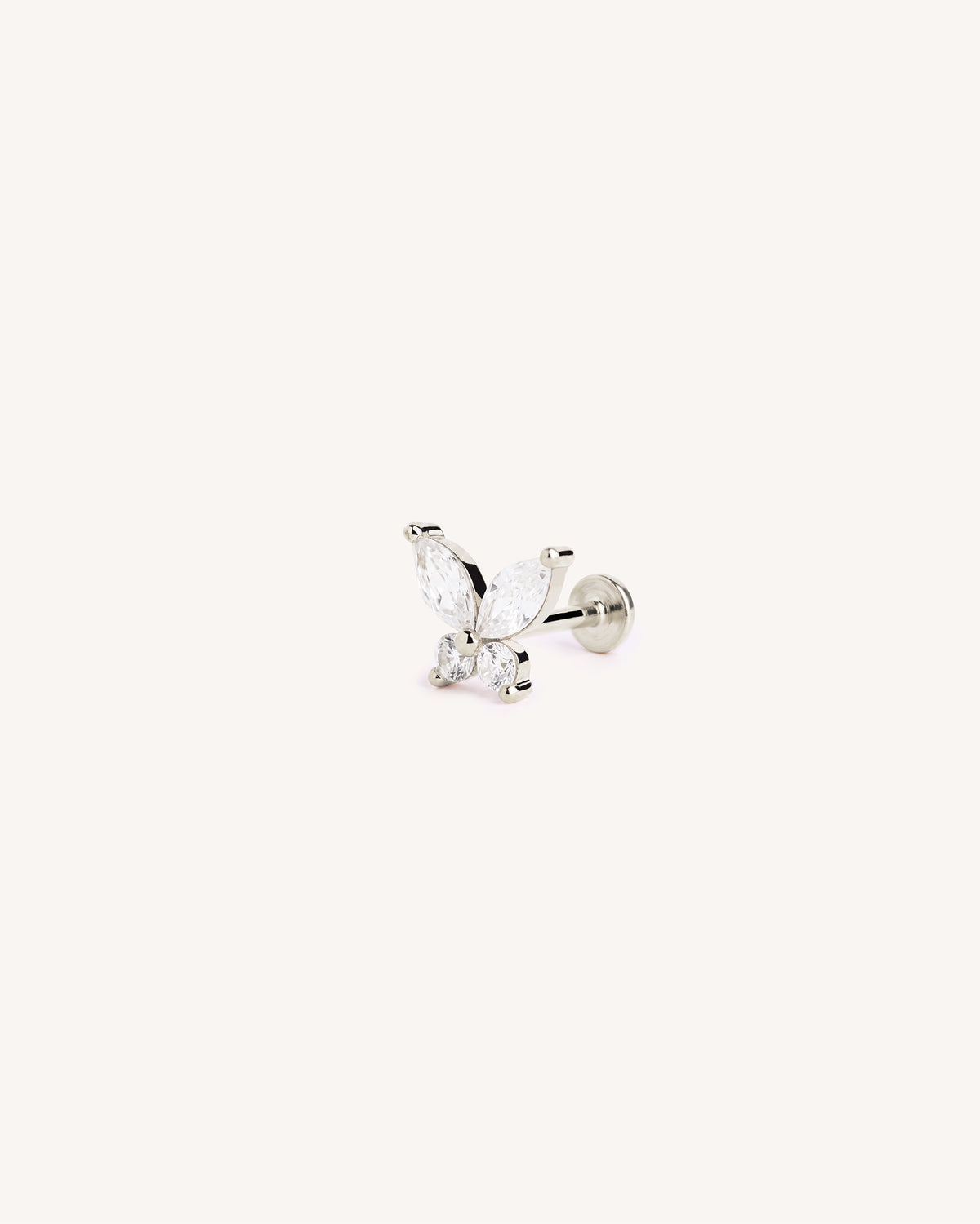 A silver butterfly flatback labret stud earring featuring marquise-cut and round clear gemstones, shown on a plain off-white background.