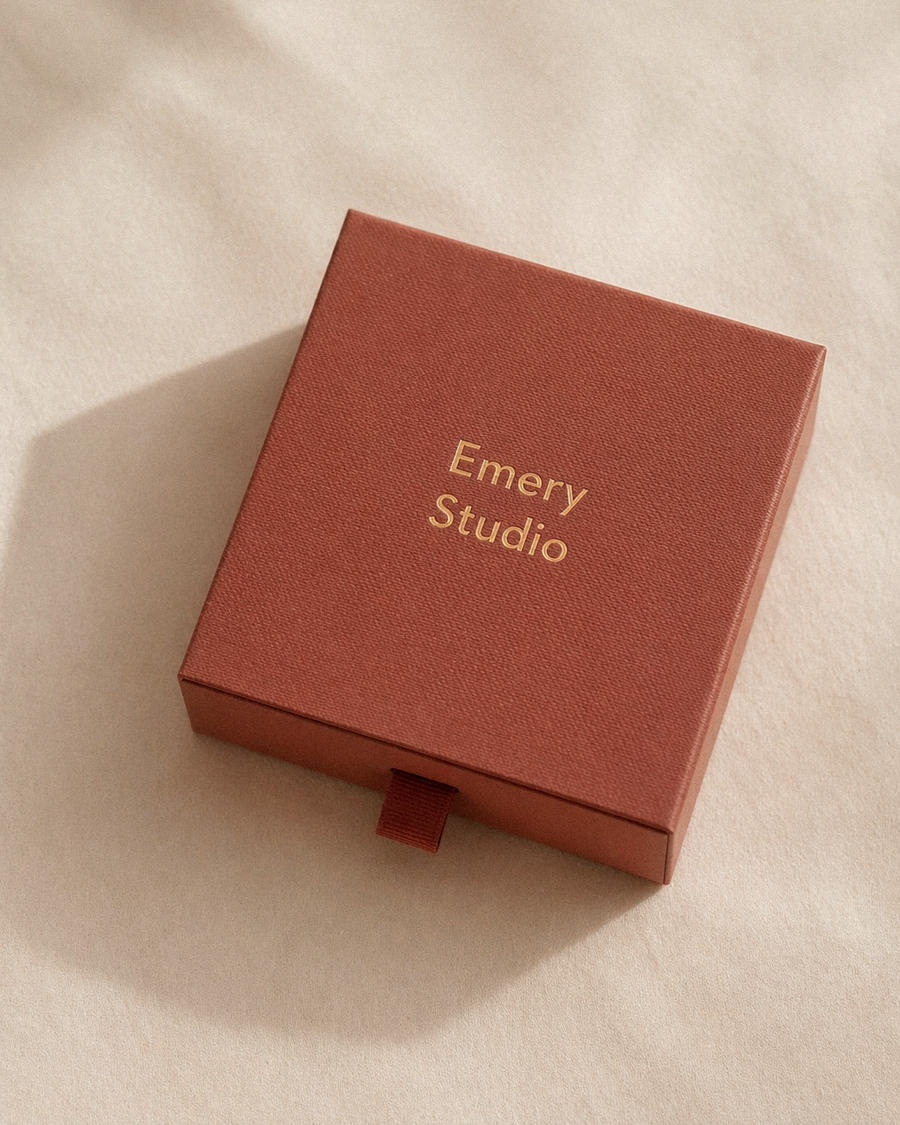  'Emery Studio' gift box on a beige background