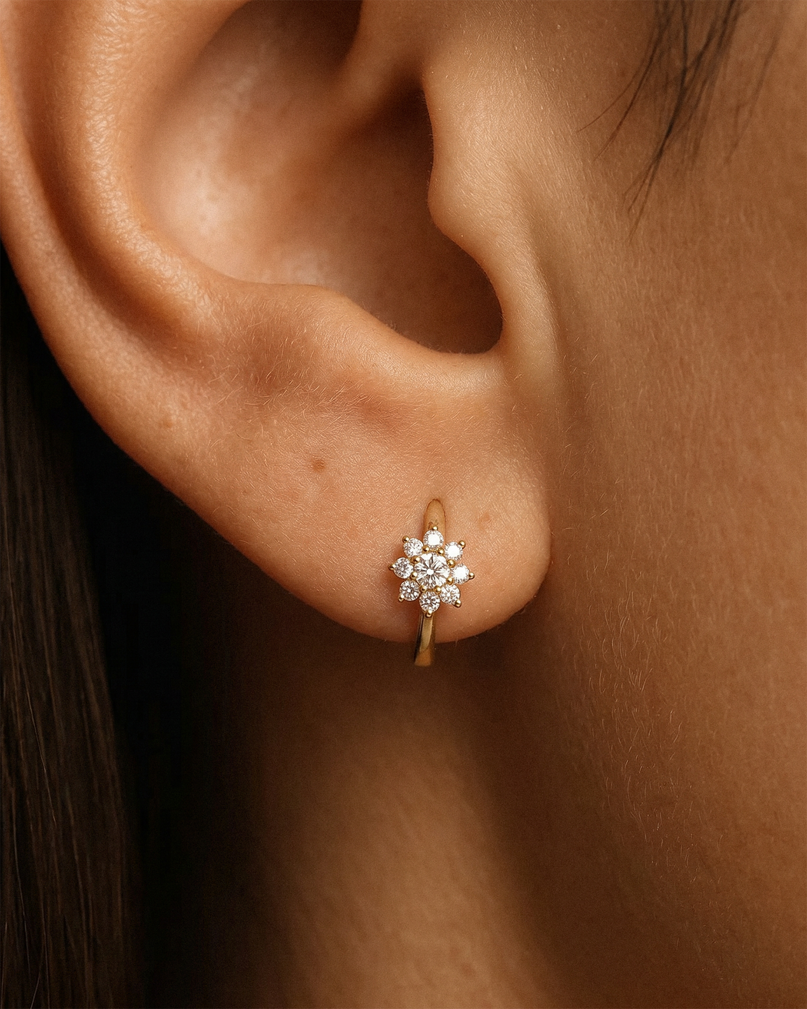 Flower Huggie Hoops in Gold — alternate view