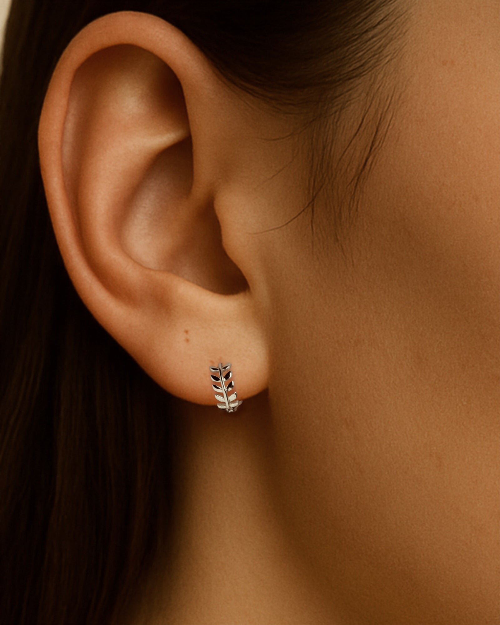 Leaf Huggie Hoops in Silver — alternate view
