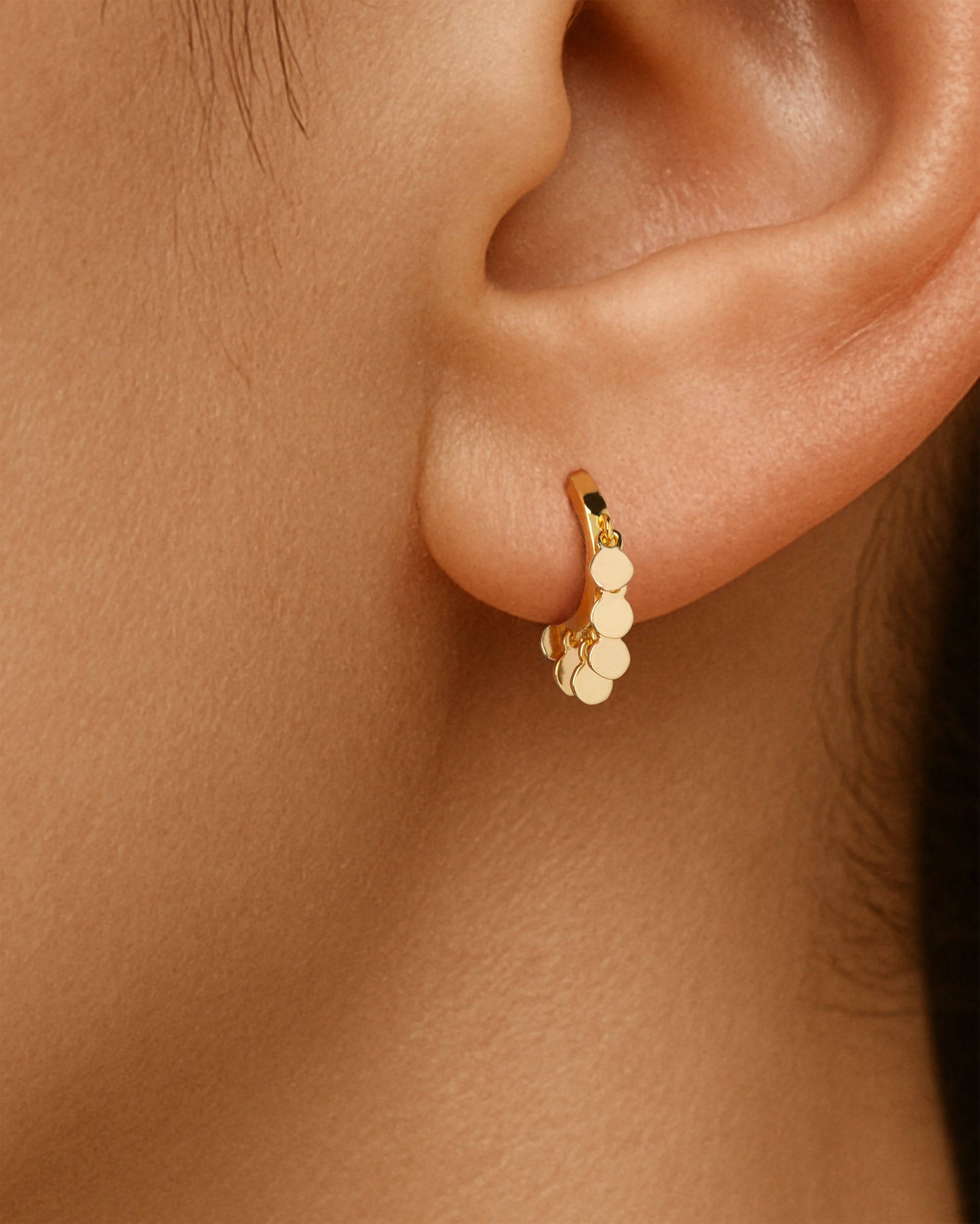 Mini Coin Huggie Hoops in Gold — alternate view