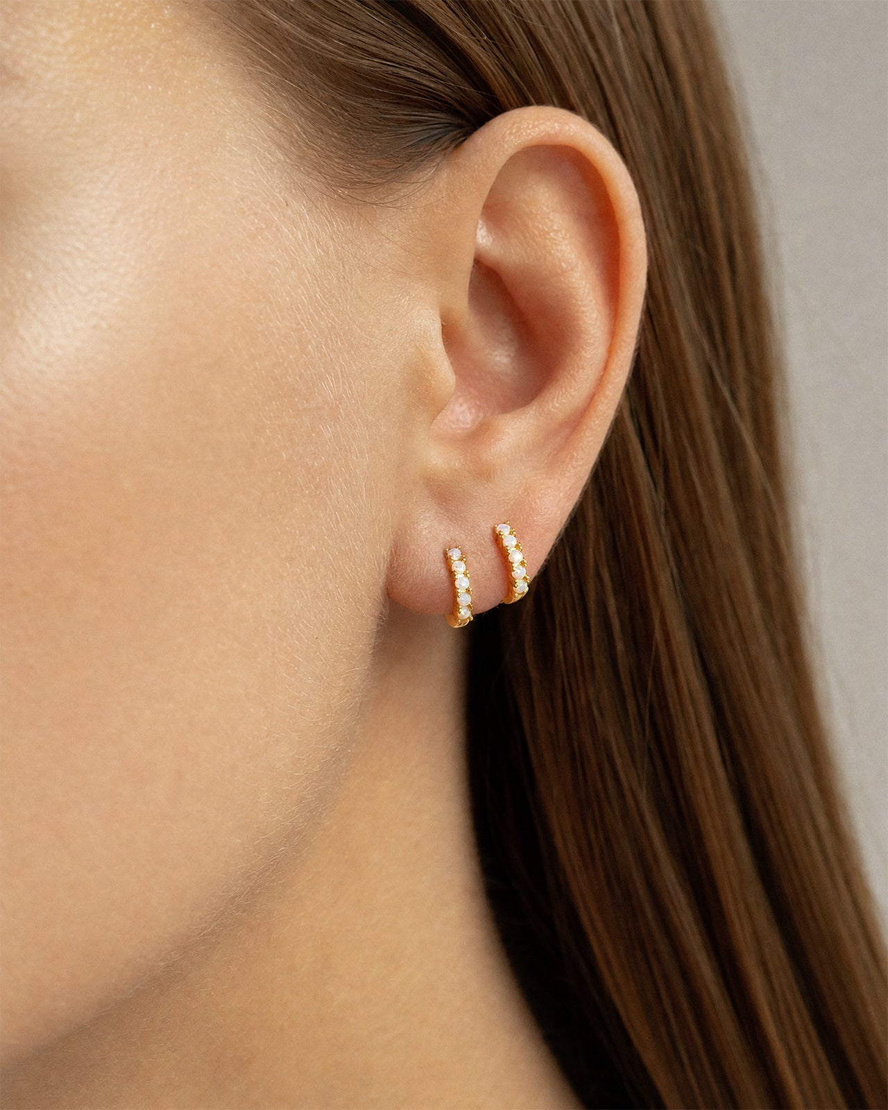 Opal Huggie Hoops in Gold — alternate view