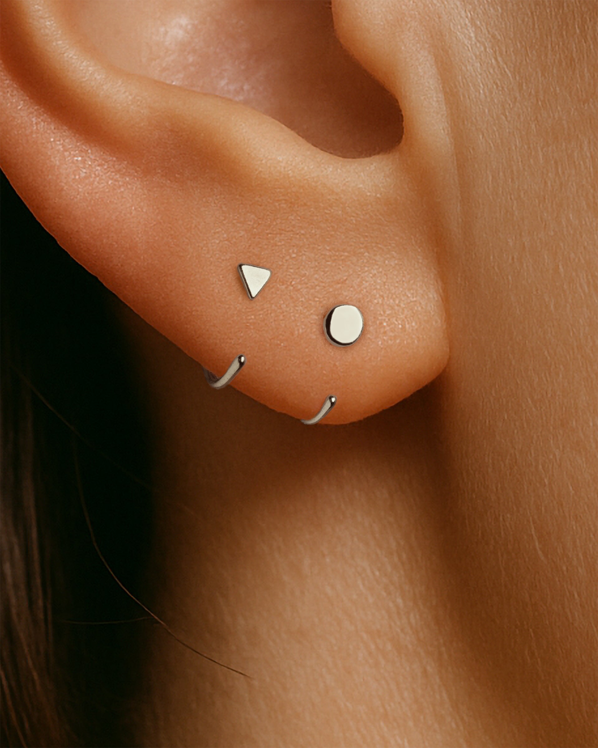 Open Triangle Huggie Earrings in Silver — alternate view