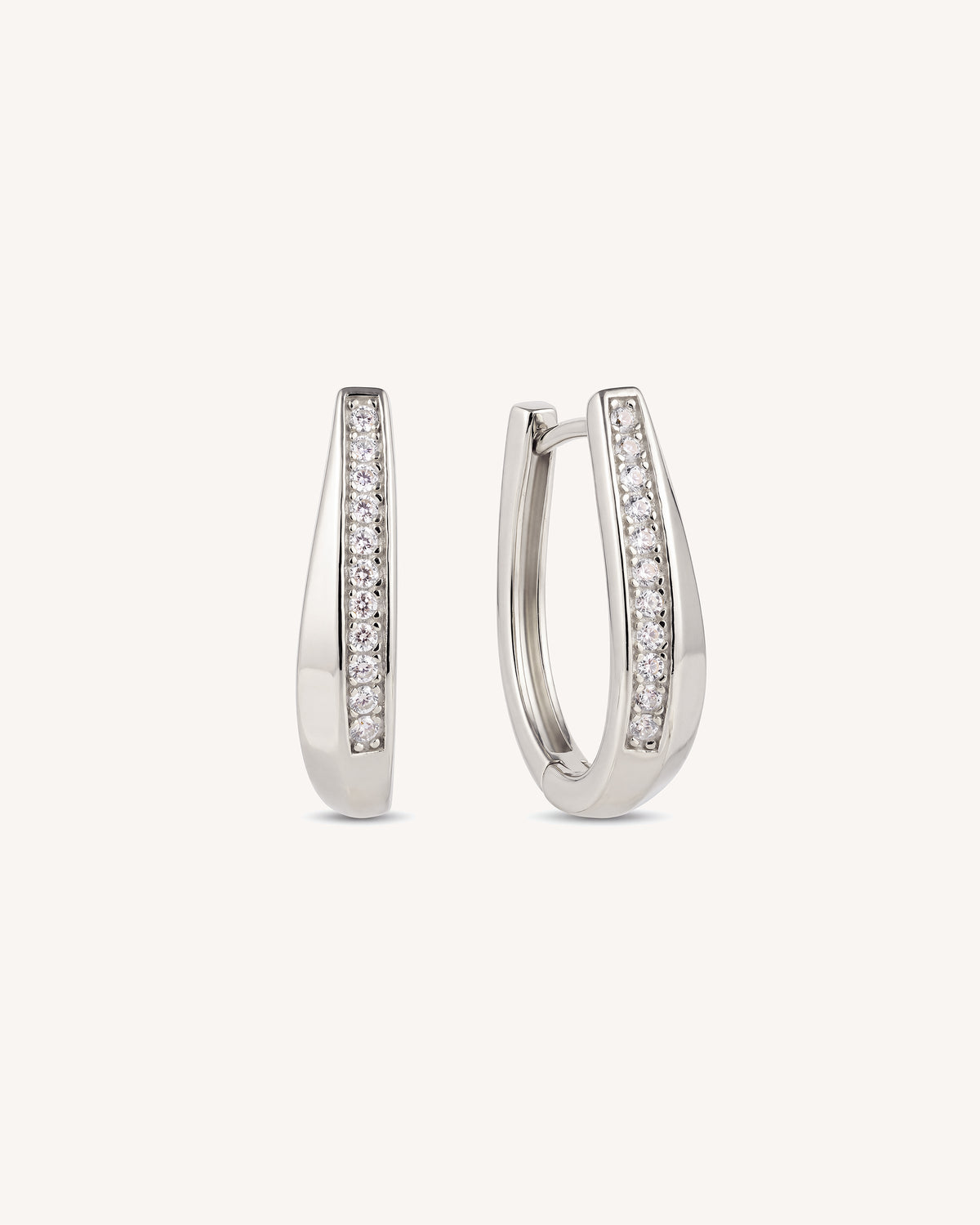 A pair of sterling 925 silver pave tapered hoops with a row of cubic zirconia stones on a plain white background.