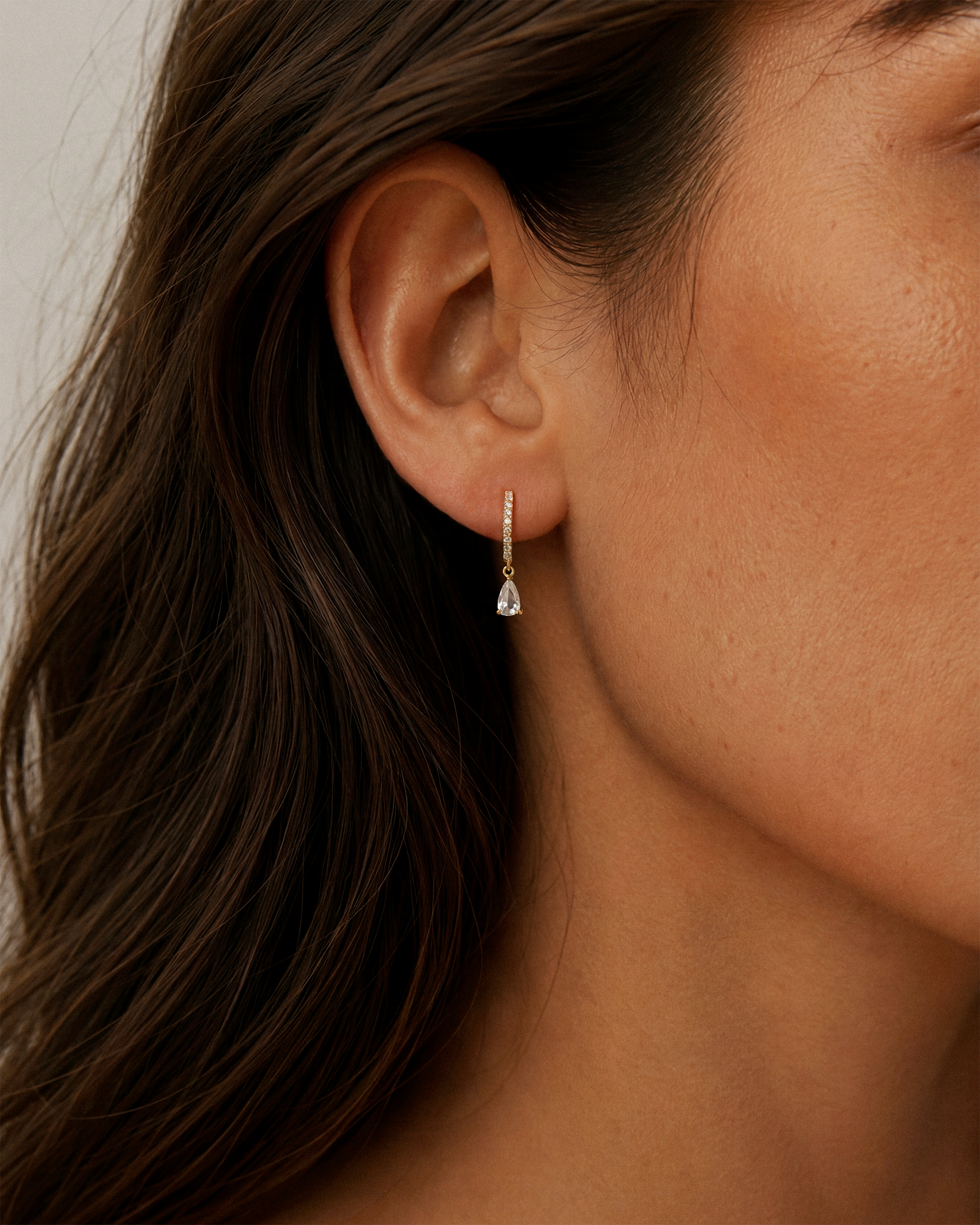 Teardrop Pave Dangle Huggie Hoops in Gold — alternate view