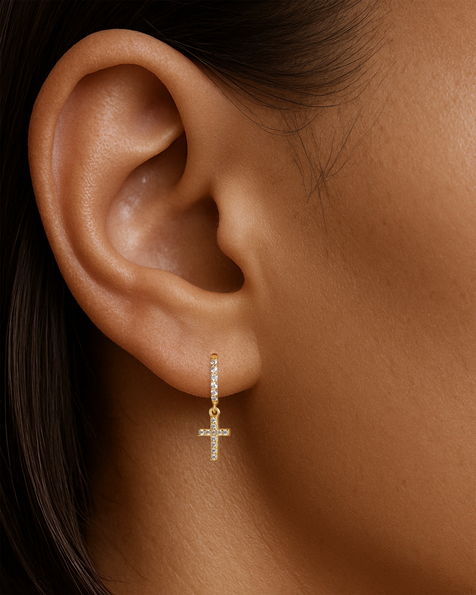 Tiny Cross Pave Dangle Huggie Hoops in Gold — alternate view