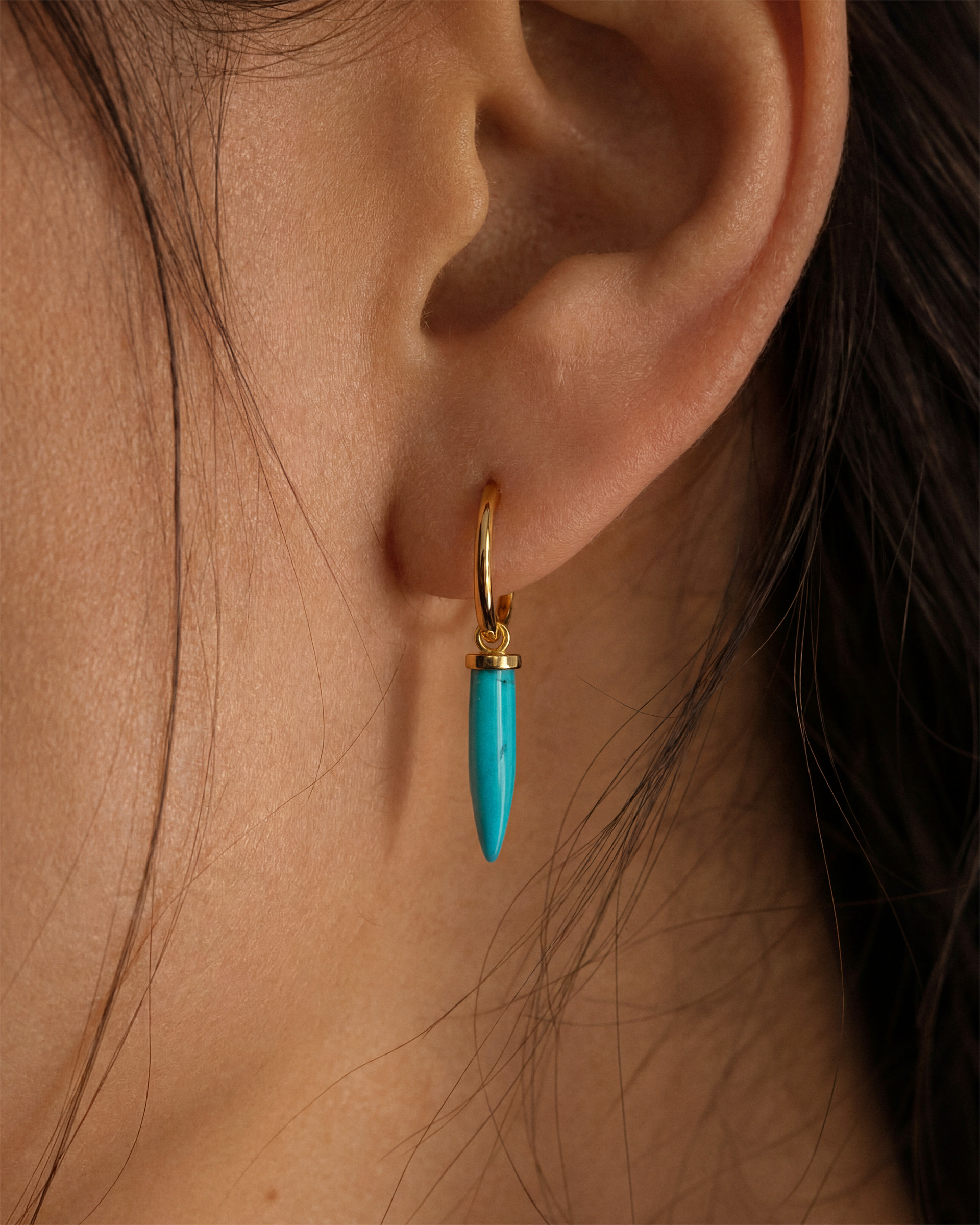 Turquoise Spike Huggie Hoops in Gold — alternate view