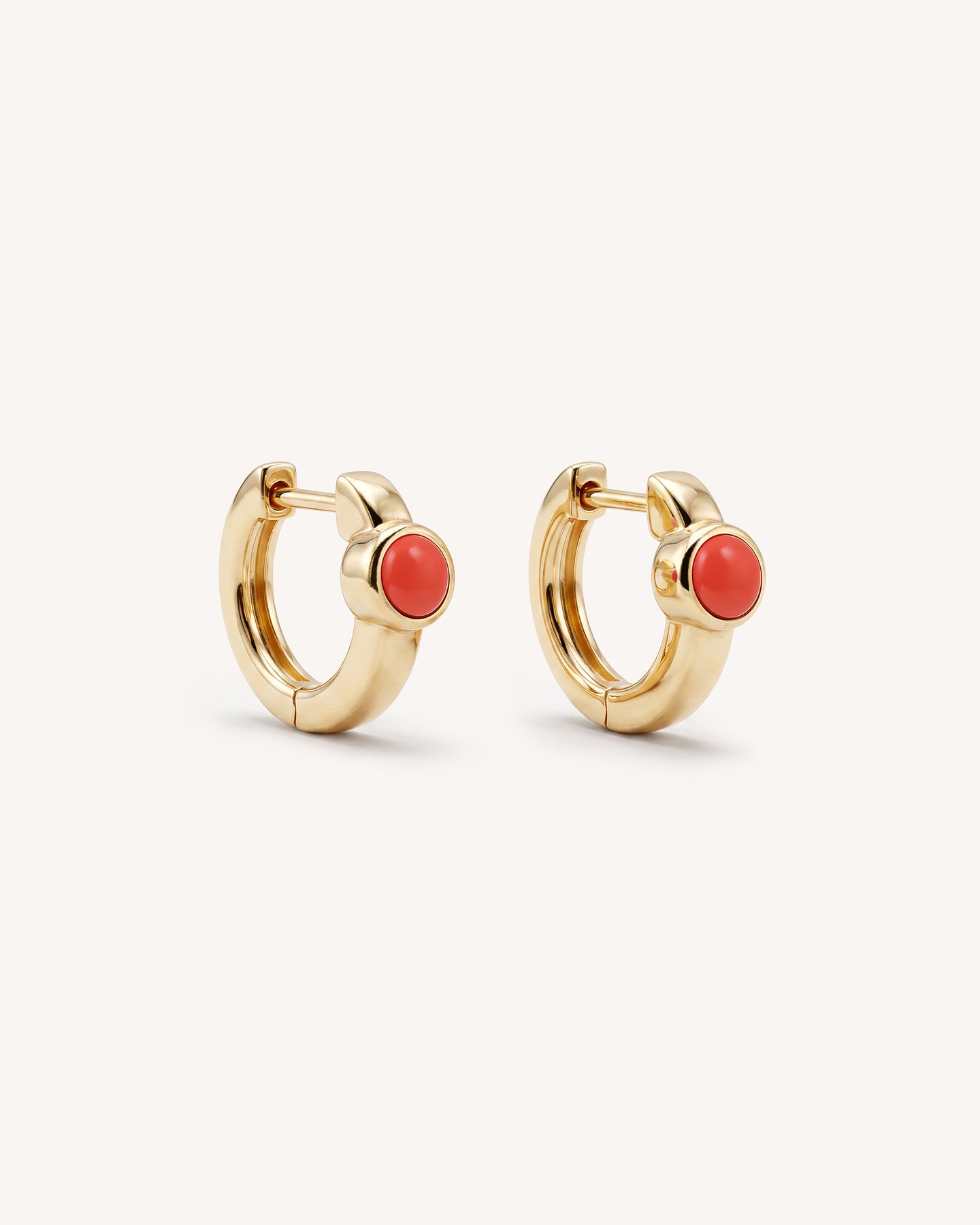 Coral Huggie Hoops in Gold