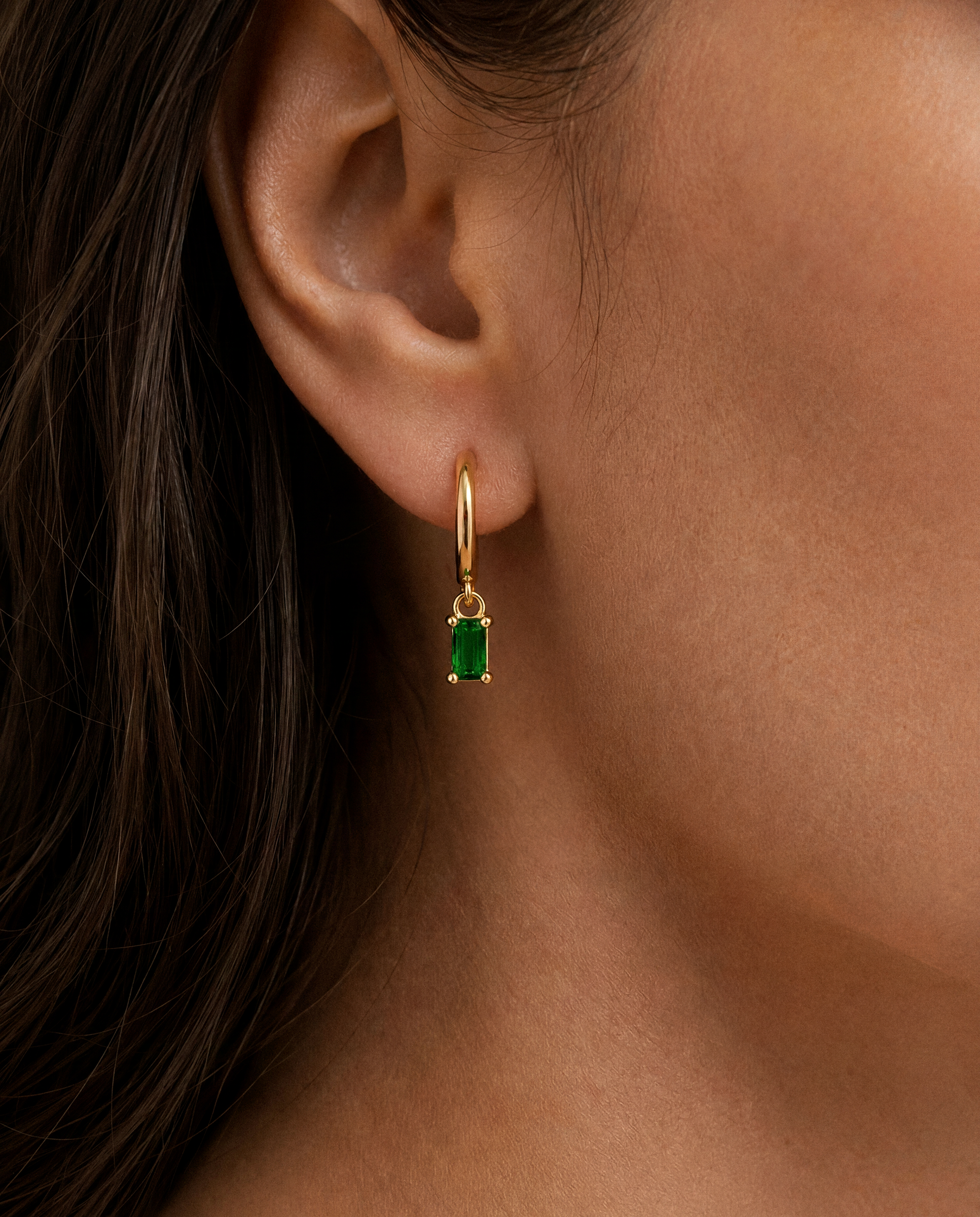 Dangle Baguette Huggie Hoops in Gold — Emerald — alternate view