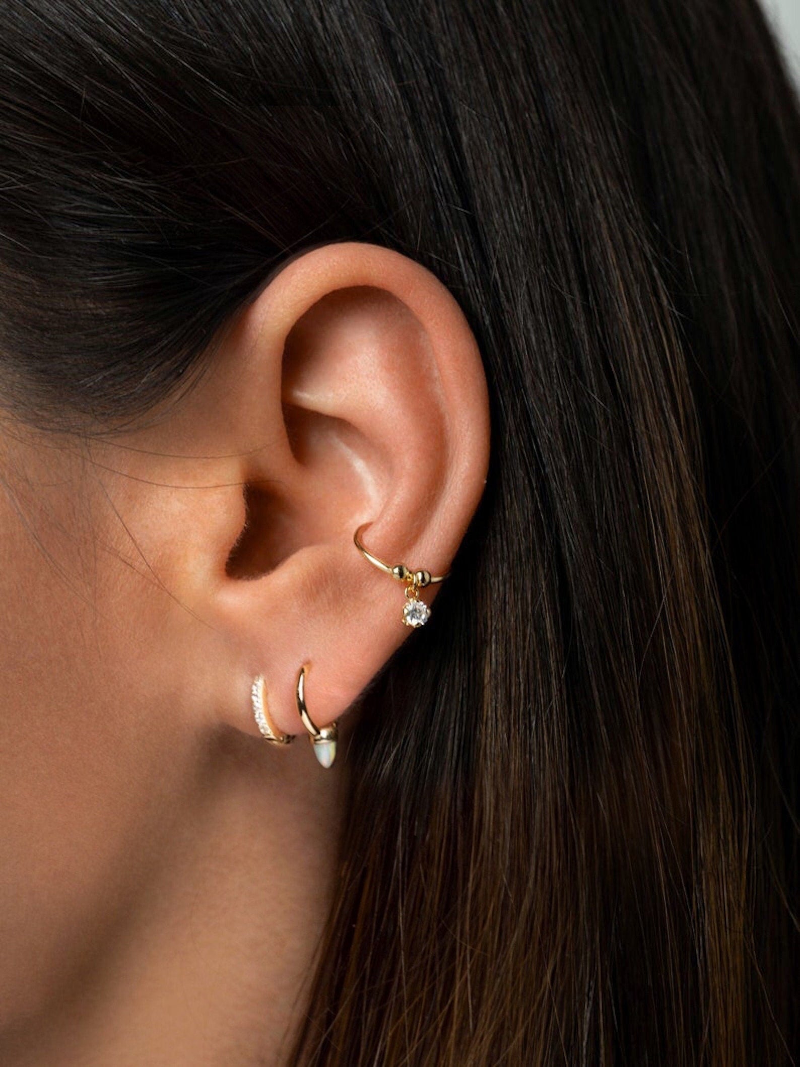 Opal Spike Huggie Hoops in Gold — alternate view