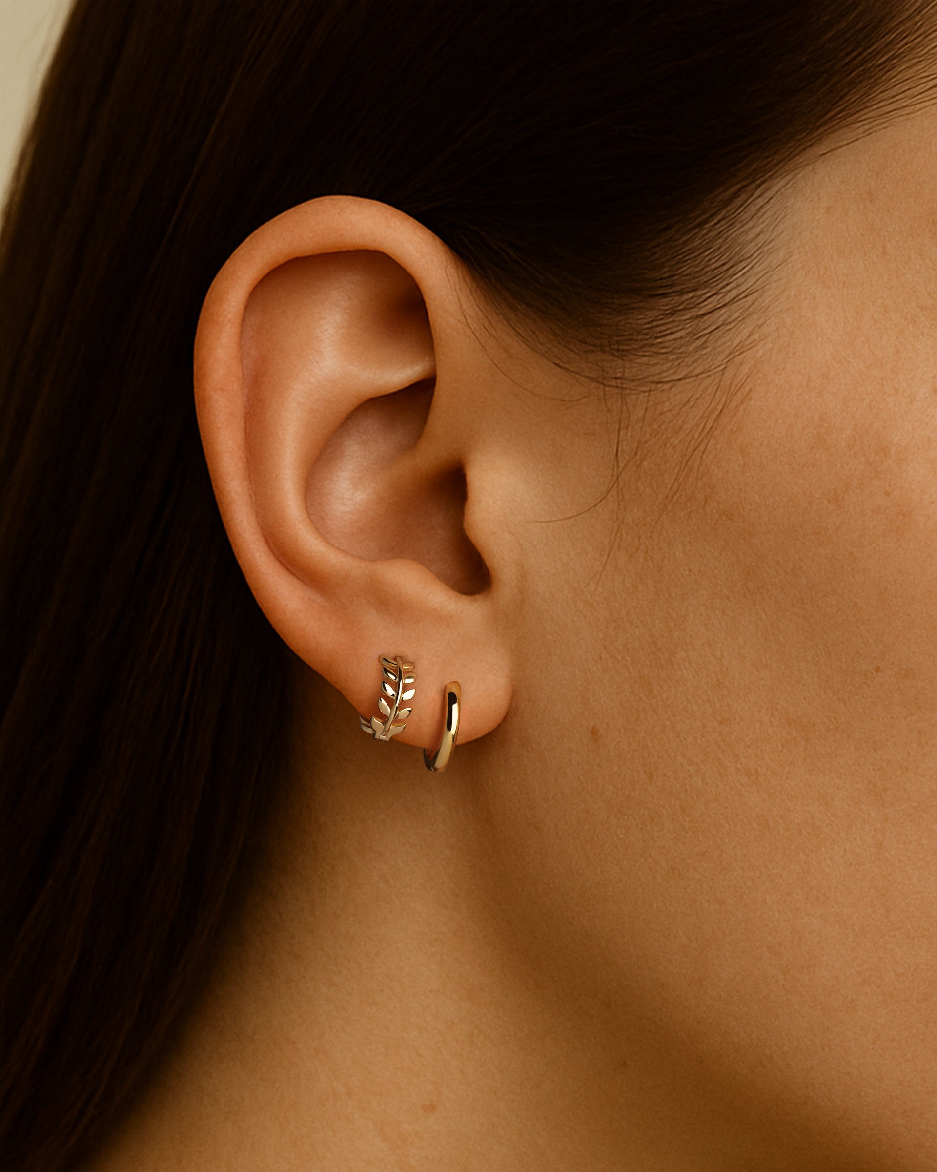 Leaf Huggie Hoops in Gold — alternate view