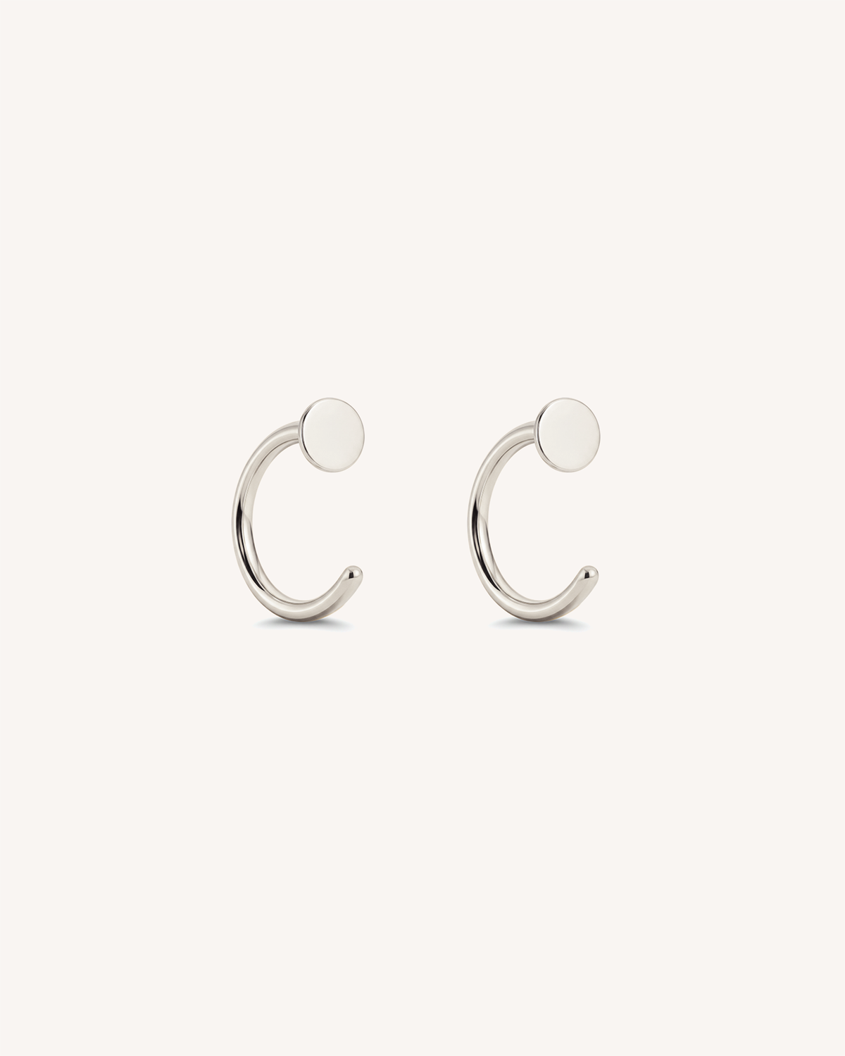 Open Disc Huggie Earrings in Silver