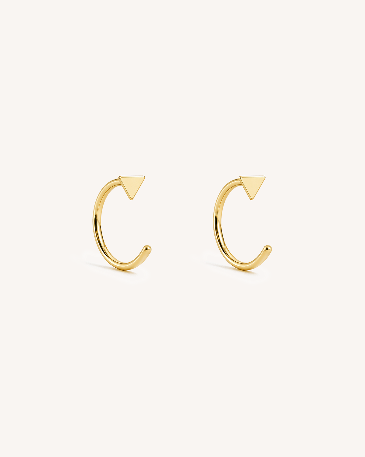 Open Triangle Huggie Earrings in Gold