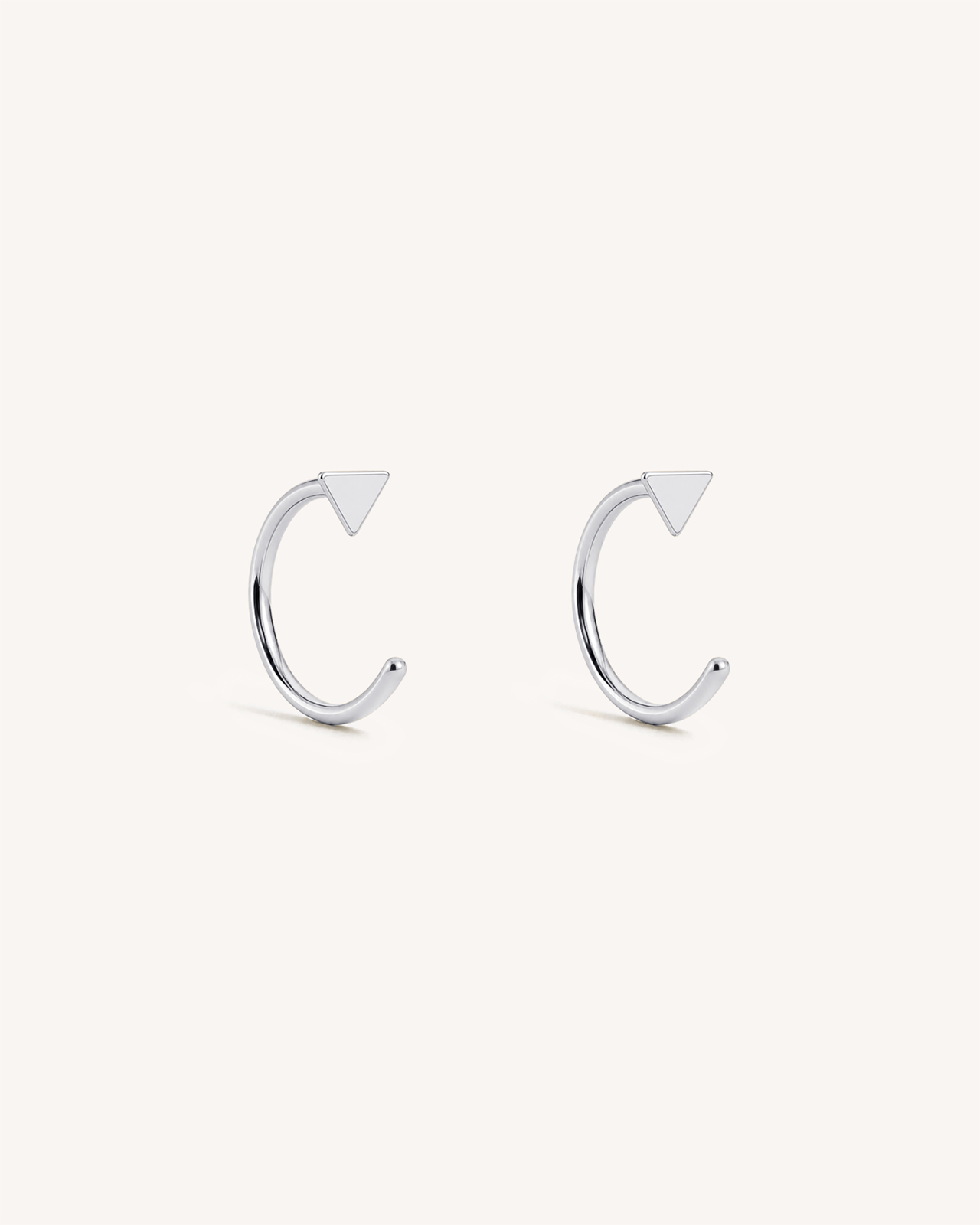 Open Triangle Huggie Earrings in Silver