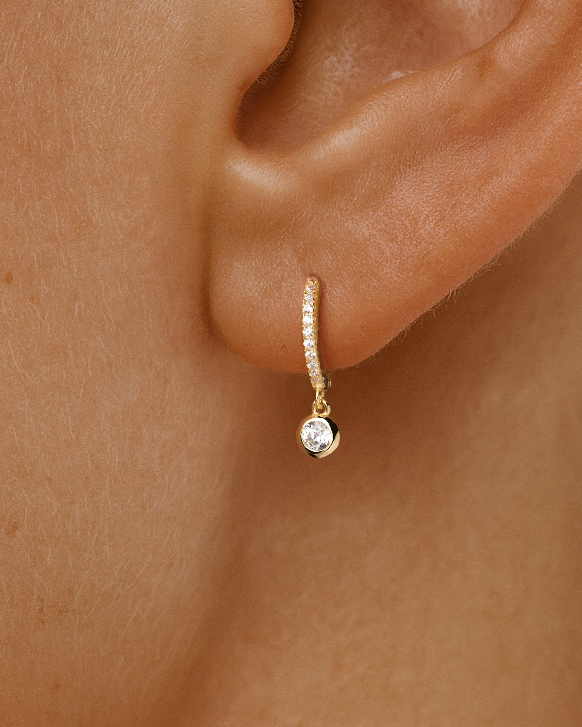 Solitaire Pave Dangle Huggie Hoops in Gold — alternate view