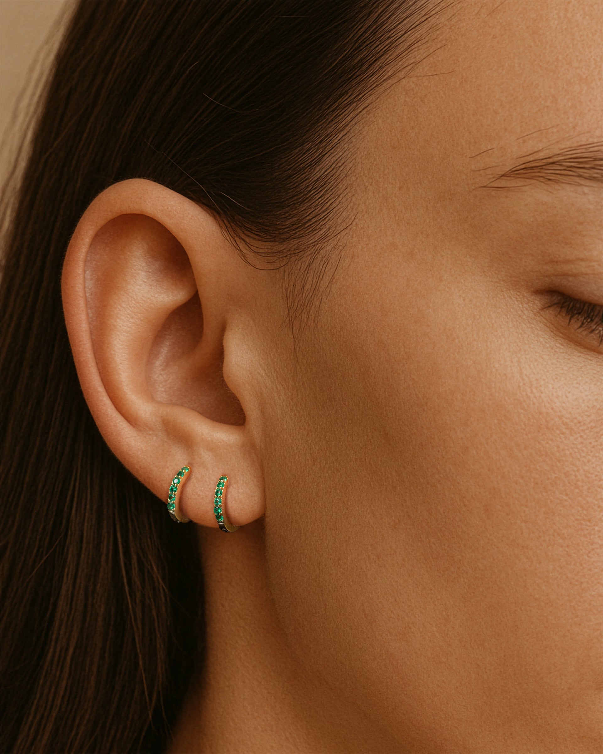 Mini Pave Huggie Hoops in Gold — Emerald — alternate view
