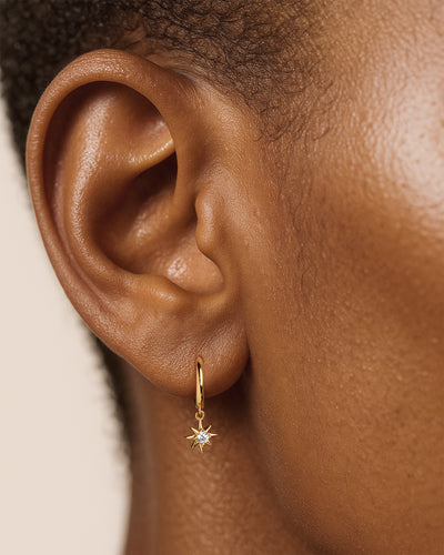 Starburst Dangle Huggie Hoops in Gold — alternate view