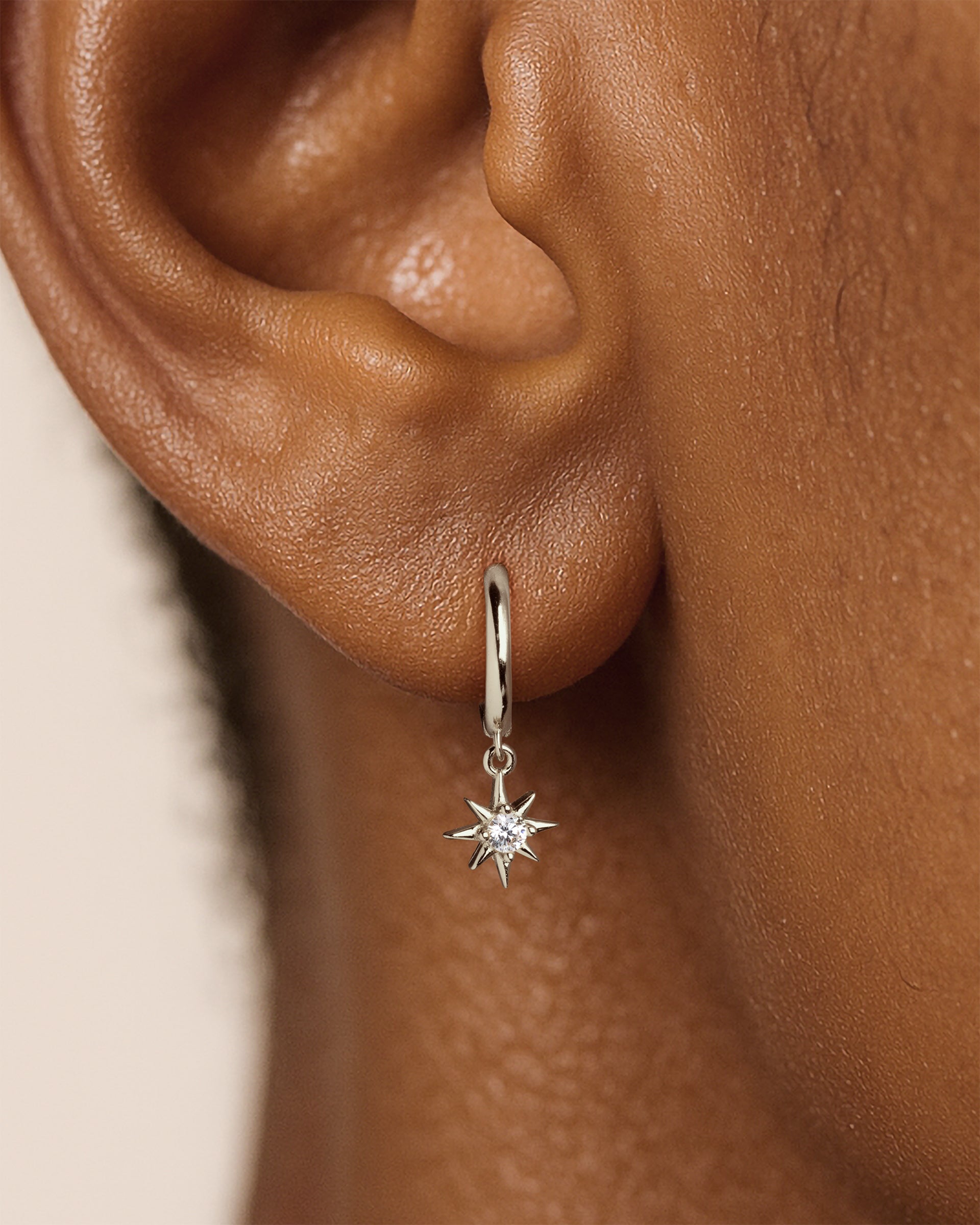 Starburst Dangle Huggie Hoops in Silver — alternate view