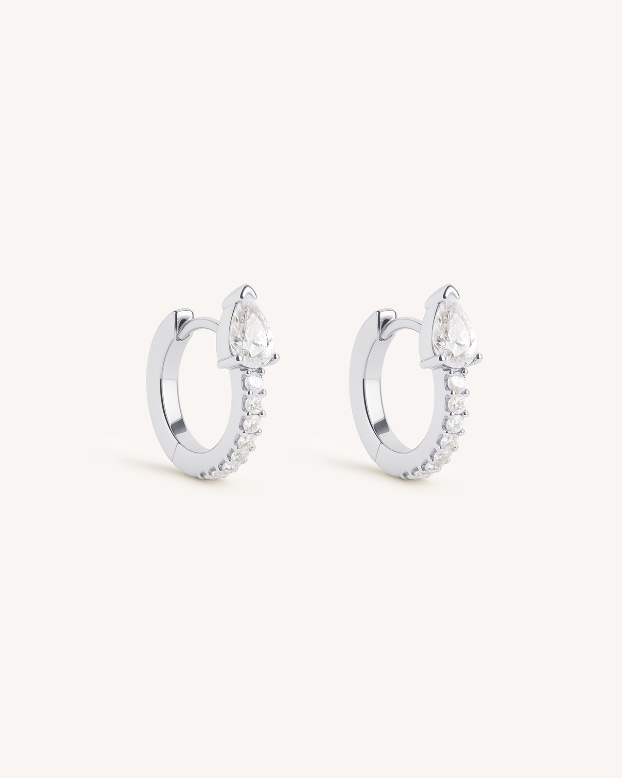 Teardrop Pave Huggie Hoops in Silver — Crystal