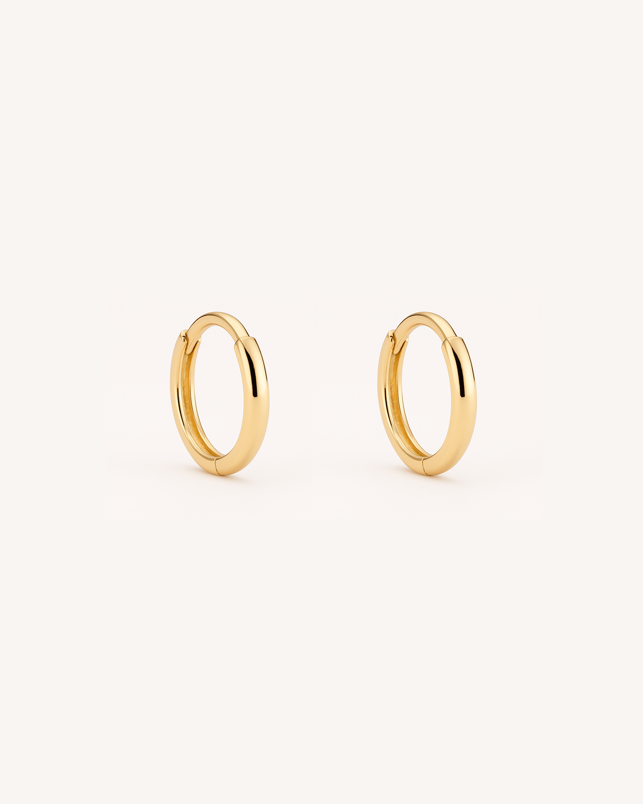 Thin Huggie Hoops in Gold — alternate view