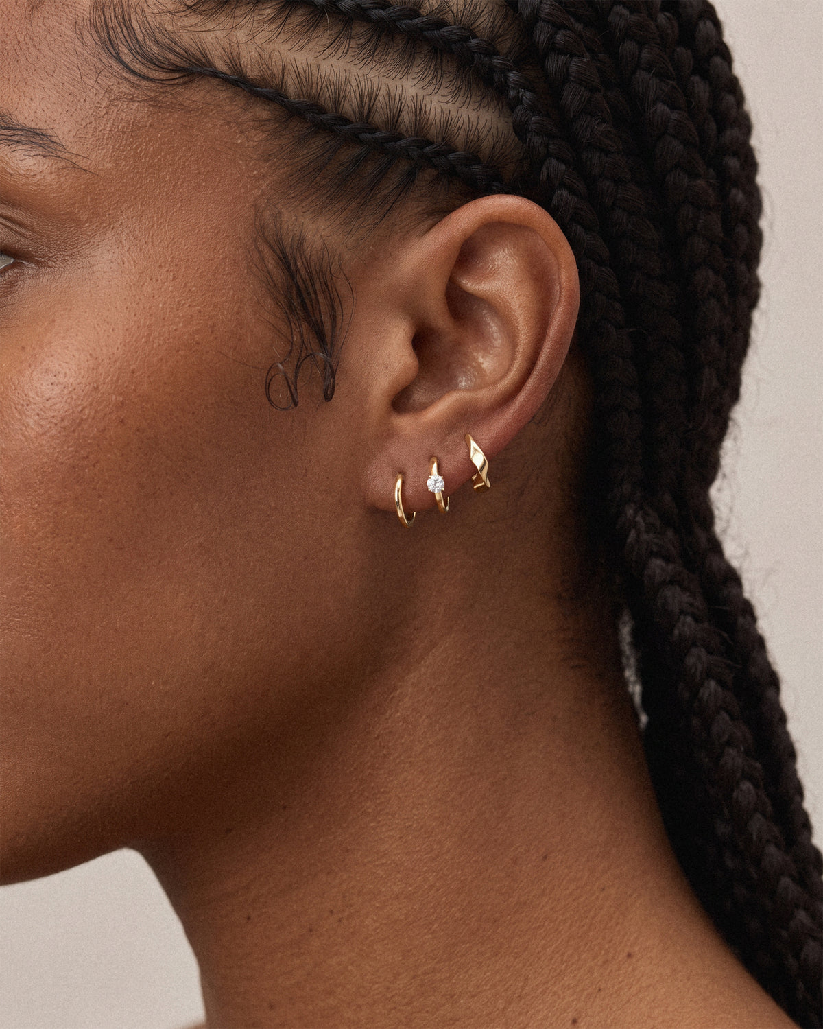 Thin huggie hoops, Classic solitaire huggie hoops and the molten huggie hoops in 18k gold plated sterling silver.