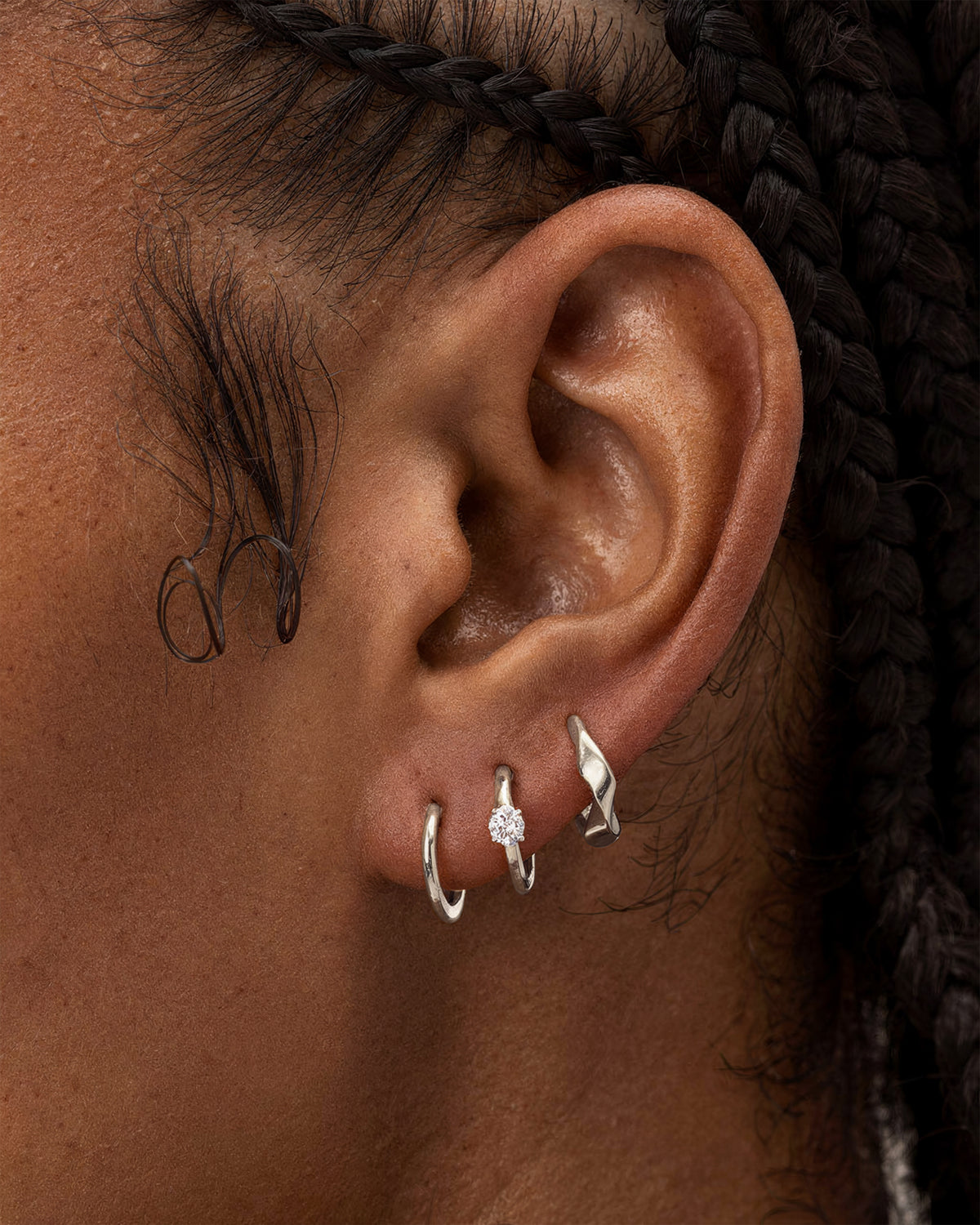 Thin huggie hoops, Classic solitaire huggie hoops and the molten huggie hoops in 925 rhodium plated sterling silver.