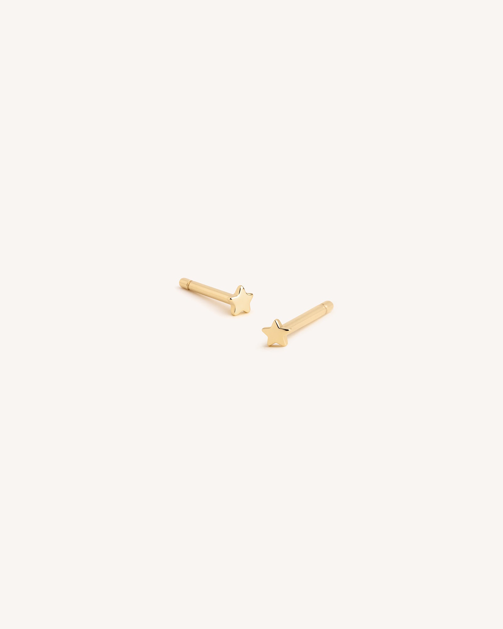 Tiny Star Studs in Gold