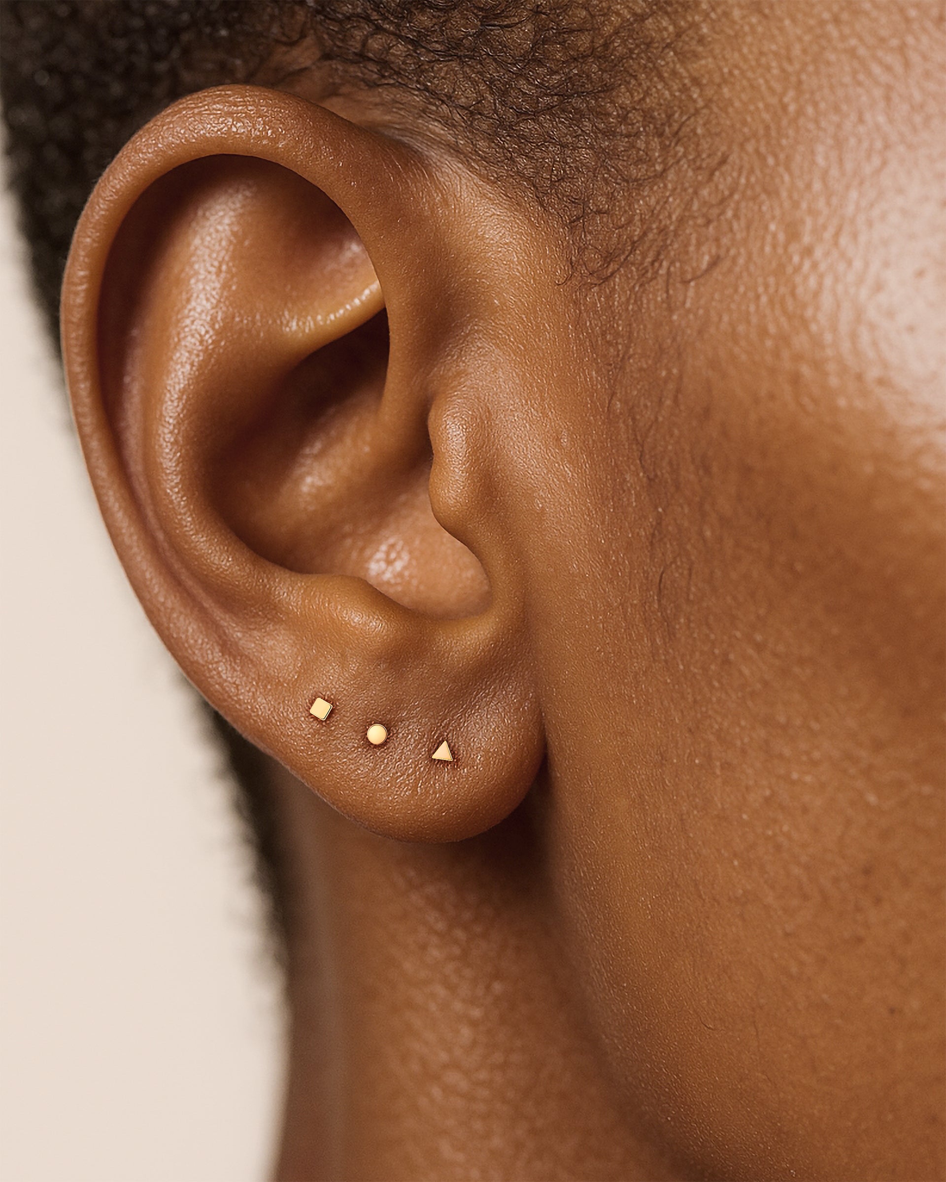 Tiny Triangle Studs in Gold — alternate view