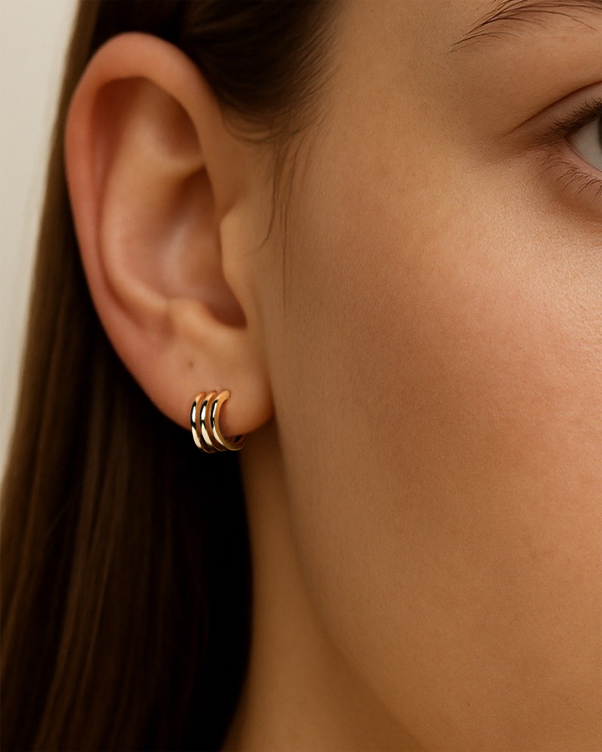 Triple Huggie Hoops in Gold — alternate view